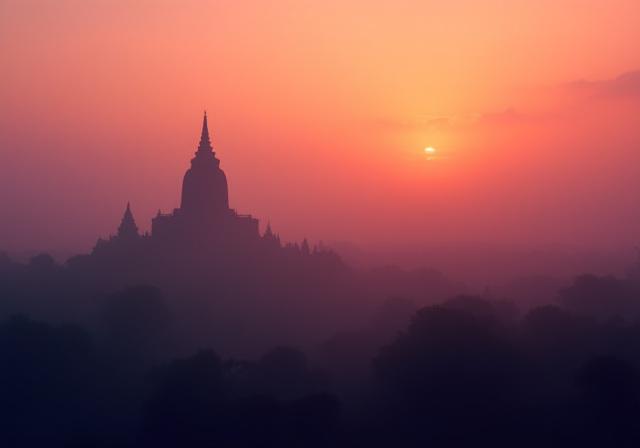 Buddhist temple at sunrise in Southeast Asia